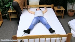 Cuffed spread eagle on the bed